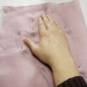 X-Puhdistuskäsineen ompelu